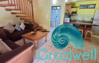 Lounge, kitchen – Sunnyrock Family Unit